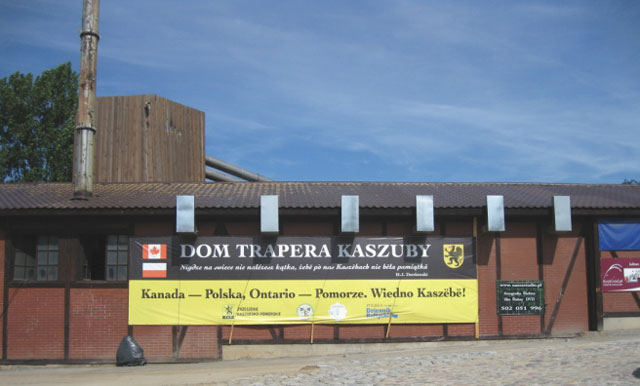 Low brick building with large banner 