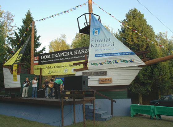 Musicians on outdoor stage decorated as a ship