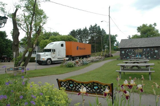 Container on transport truck leaving Heritage Park in Wilno